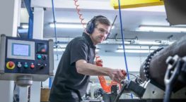 Worker performing test on machinery