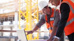 Construction Workers on Laptop